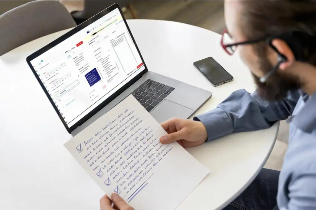 A helpline operator checks AI data summary after call A helpline operator checks AI data summary after call