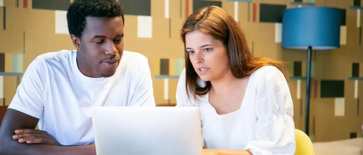 Two people looking at search results